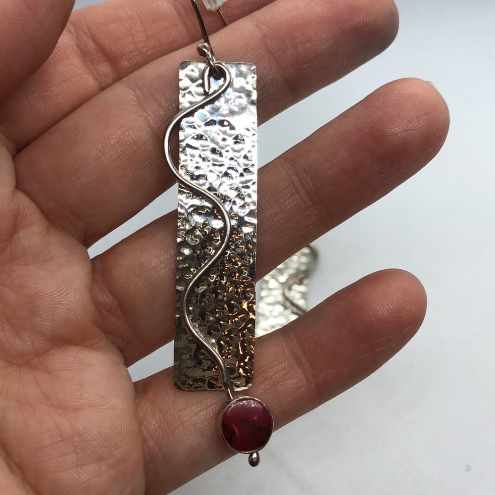 Sterling Silver dangle earrings.